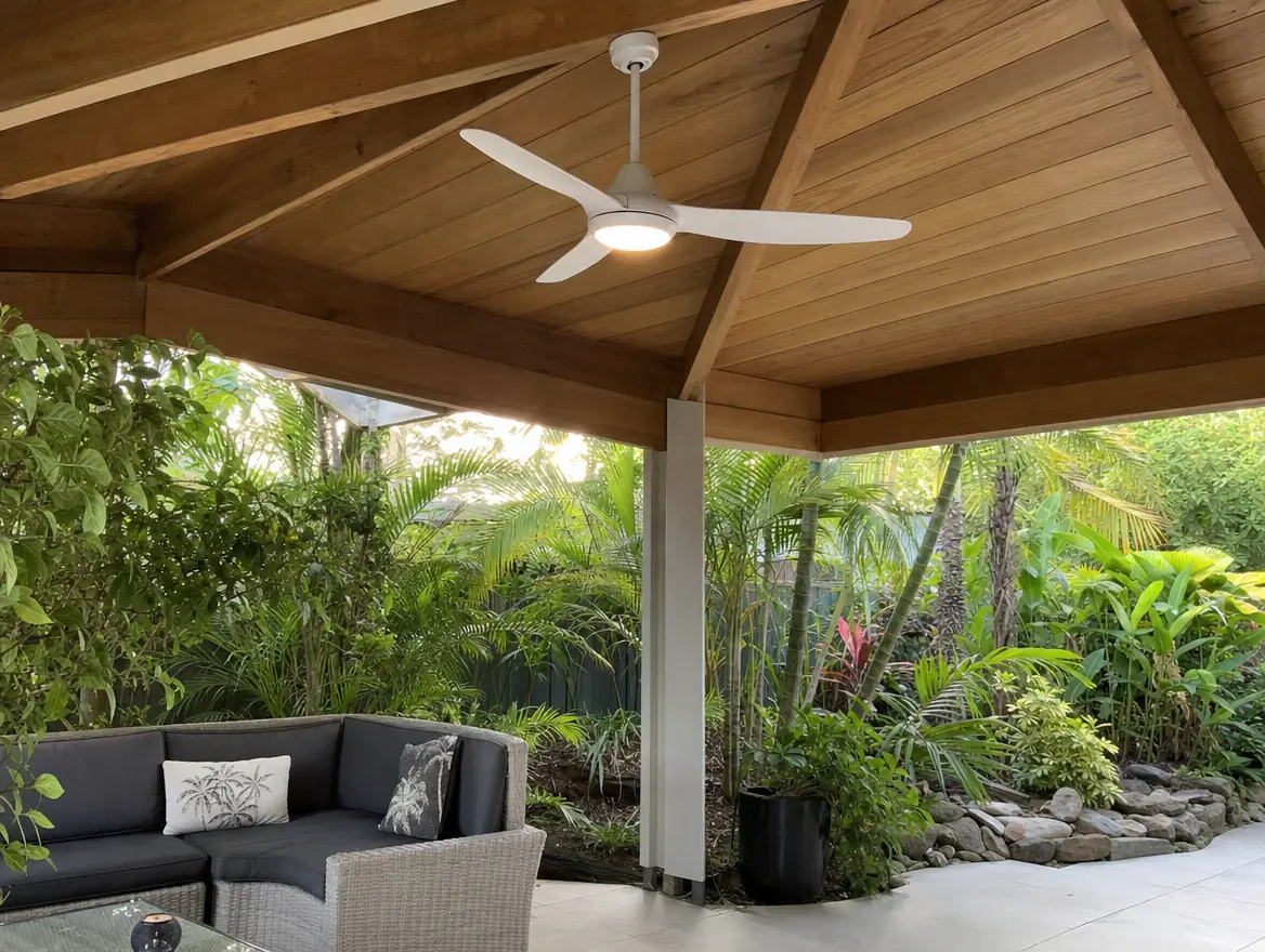 A ceiling fan with an LED light in a covered outdoor living area