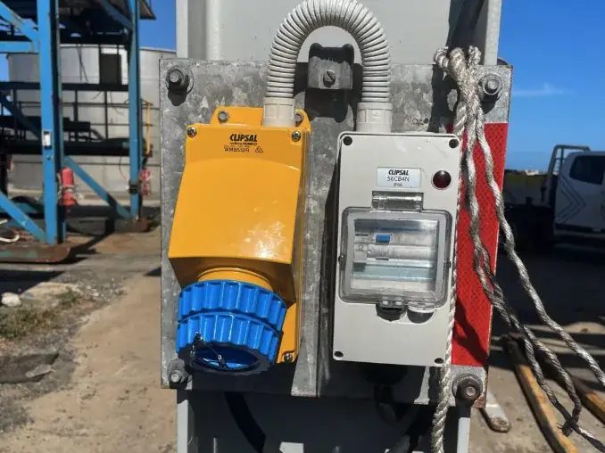 Outdoor industrial outlet and weatherproof enclosure installed on a steel column